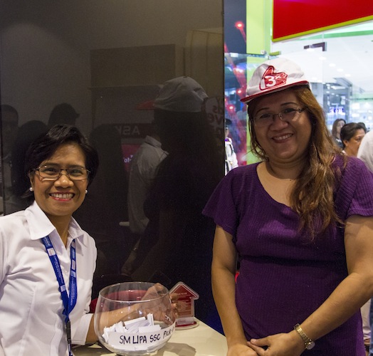 PLDT Customer Care Assistant with one of the first few customers of the new store