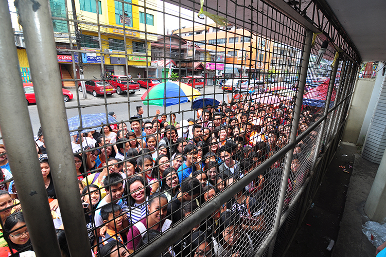 The volleyball aficionados and families of Iloilo waited excitedly for the gates of the University of San Agustin Gym to officially open.