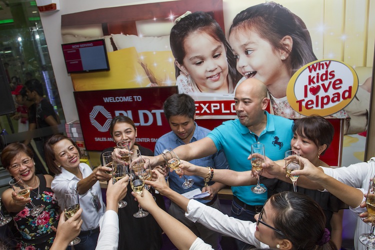 Customer Care Executives and SSC Team share a toast